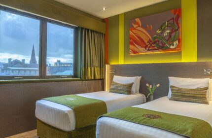 Temple Bar Inn gay-friendly hotel room with twin beds, green accents, and a view of Dublin. Ideal lodging for gay travelers in Temple Bar.