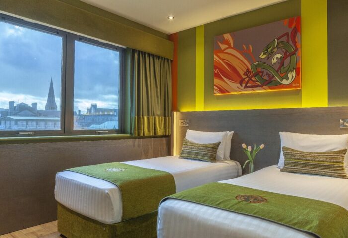 Temple Bar Inn gay-friendly hotel room with twin beds, green accents, and a view of Dublin. Ideal lodging for gay travelers in Temple Bar.