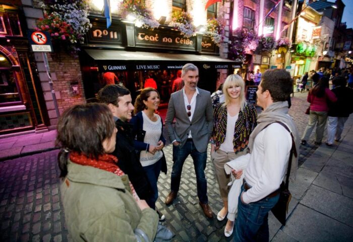 Gay-Friendly Hotel Temple Bar Lane by the KeyCollections: People gather outside a pub on Temple Bar Lane, Dublin. Nightlife in Ireland.