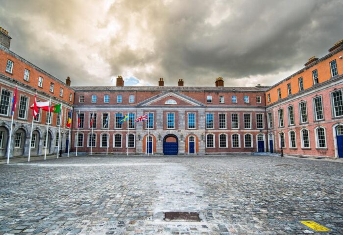 Temple Bar Lane by the KeyCollections. Dublin Castle courtyard view. Gay-friendly hotel near Temple Bar, Dublin. Flags and architecture.