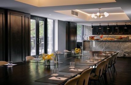 The Anndore House, part of JVD by Hyatt, gay-friendly hotel. Meeting room with long table, catering, and modern design.