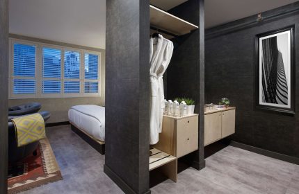 The Anndore House, part of JVD by Hyatt, a gay-friendly hotel. Room interior with bed, chair, closet, and modern decor. Stylish stay.