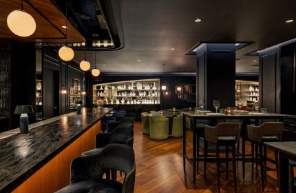 The Anndore House, part of JVD by Hyatt, a gay-friendly hotel. Interior view of the bar and dining area with stylish decor.