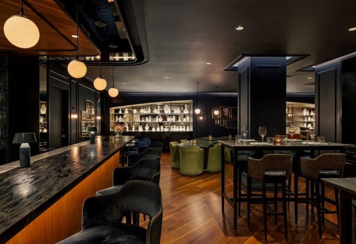 The Anndore House, part of JVD by Hyatt, a gay-friendly hotel. Interior view of the bar and dining area with stylish decor.