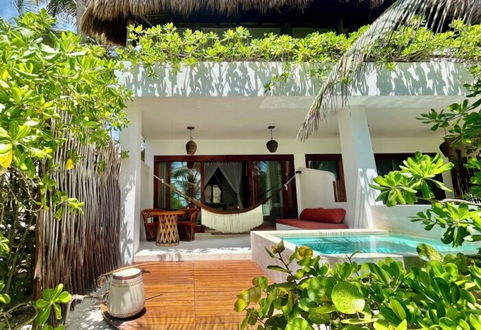The Beach Tulum Hotel gay-friendly suite. Hammock, plunge pool, and lush greenery create a relaxing vibe for gay travel in Tulum.