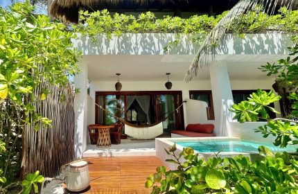 The Beach Tulum Hotel gay-friendly suite. Hammock, plunge pool, and lush greenery create a relaxing vibe for gay travel in Tulum.