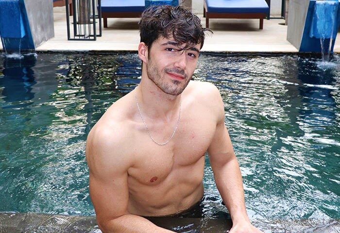 Gay-friendly hotel: The Butterfly Pea. Attractive man in a pool at this gay hotel. A great vacation spot for gay men travelers.