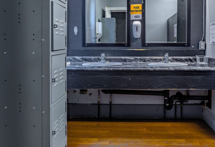 Cambie Hostel Gastown's gay-friendly bathroom. Lockers, sinks, and mirrors. Budget travel for gay men in Vancouver, Canada.
