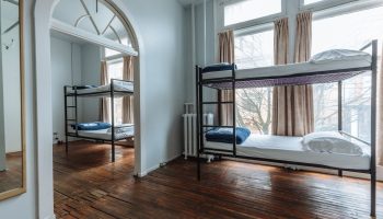 The Cambie Hostel Gastown dorm room. Budget-friendly, gay-friendly hotel with bunk beds and wooden floors. Ideal for gay travelers.
