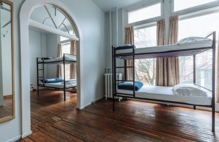 The Cambie Hostel Gastown dorm room. Budget-friendly, gay-friendly hotel with bunk beds and wooden floors. Ideal for gay travelers.
