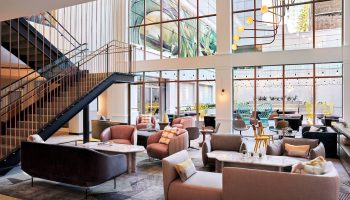 The Clancy Autograph Collection gay-friendly hotel lobby. Modern design, stylish seating, and large windows. Great for gay travel.