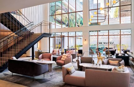 The Clancy Autograph Collection gay-friendly hotel lobby. Modern design, stylish seating, and large windows. Great for gay travel.
