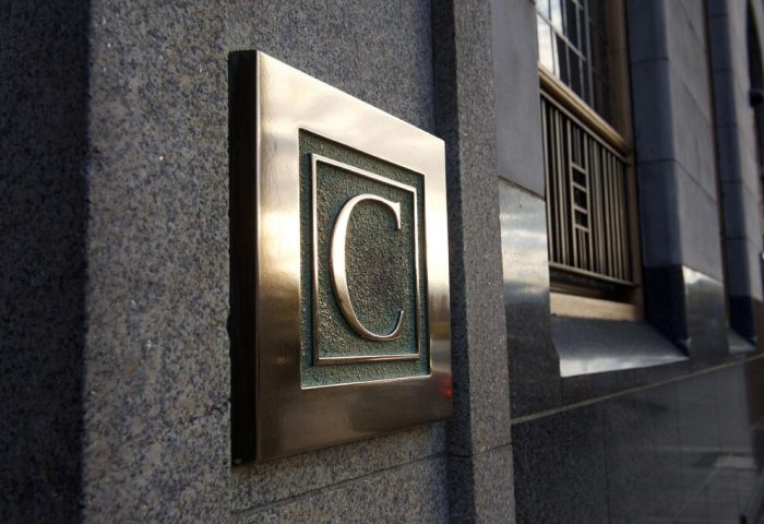 The Clarence, a gay-friendly hotel: bronze 'C' logo on the building's exterior. A great choice for gay travelers in search of welcoming accommodations.