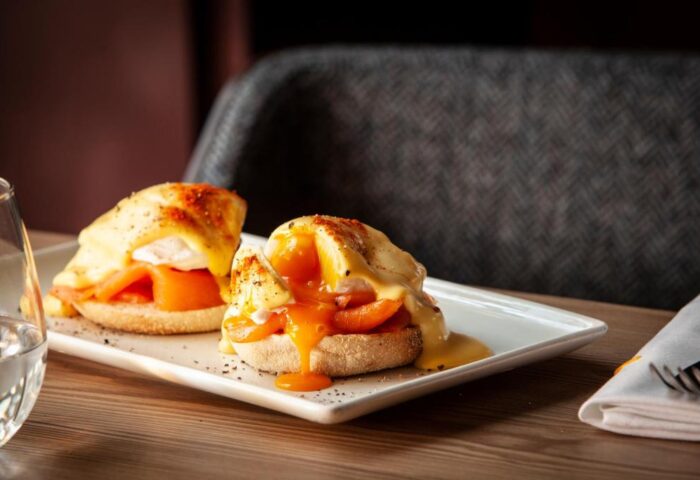 Eggs Benedict at The Clermont London Charing Cross, a gay-friendly hotel. Delicious breakfast with salmon and hollandaise sauce. Gay travel advice.