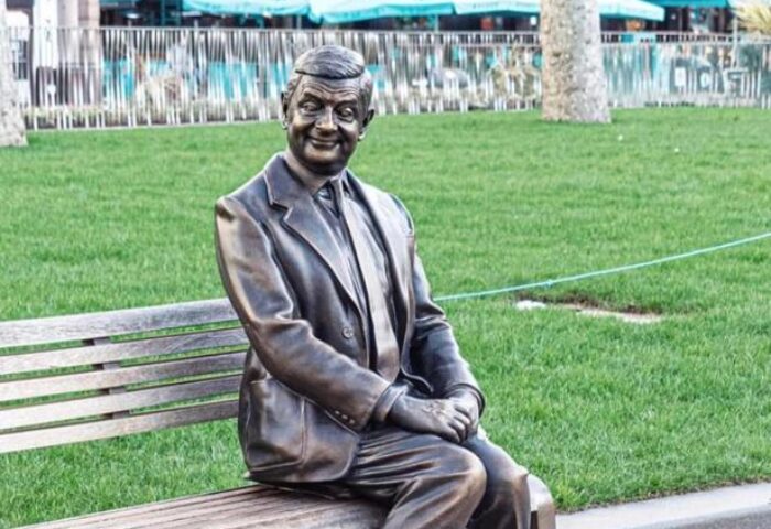 Mr. Bean statue near The Clermont London Charing Cross, a gay-friendly hotel. Bronze statue on a bench in London.