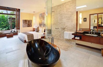 Elysian Boutique Villa Hotel gay-friendly suite. Black tub, bed, & bath. Luxury gay travel in Bali. Hotel interior.