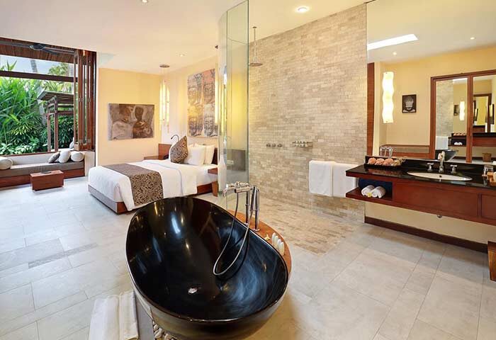 Elysian Boutique Villa Hotel gay-friendly suite. Black tub, bed, & bath. Luxury gay travel in Bali. Hotel interior.