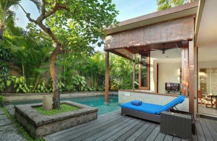 The Elysian Boutique Villa Hotel's gay-friendly pool view. Lush garden, private pool, and relaxing daybed for a luxurious gay getaway.