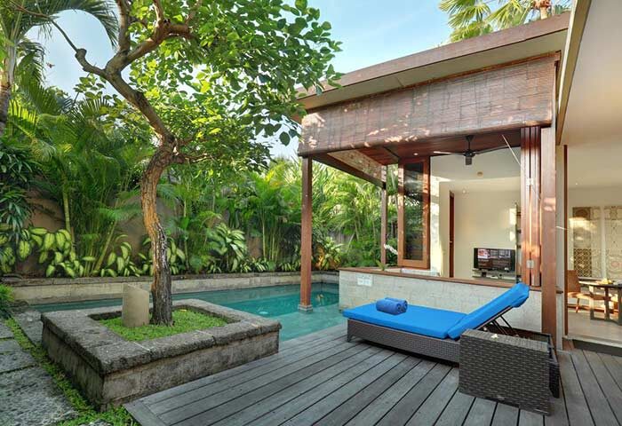 The Elysian Boutique Villa Hotel's gay-friendly pool view. Lush garden, private pool, and relaxing daybed for a luxurious gay getaway.