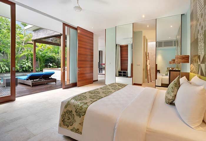 Elysian Boutique Villa Hotel gay-friendly suite. Luxurious bedroom with pool view. Gay travel, boutique hotel, villa, hotel room.
