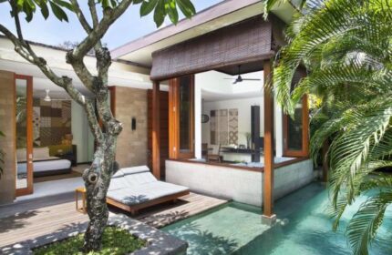 The Elysian Boutique Villa Hotel, a gay-friendly hotel. View of a luxury villa with private pool, daybed, and bedroom. Ideal for gay travel.
