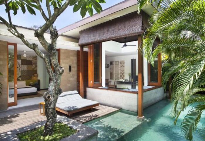 The Elysian Boutique Villa Hotel, a gay-friendly hotel. View of a luxury villa with private pool, daybed, and bedroom. Ideal for gay travel.