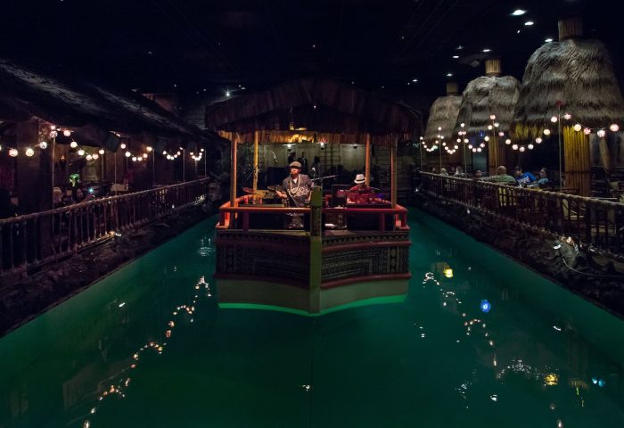 Fairmont San Francisco Hotel's Tonga Room: Gay-friendly hotel bar with live music on a boat in a pool. Tiki huts & string lights add to the vibe.