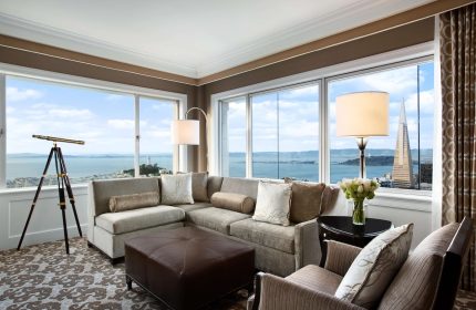 Fairmont San Francisco Hotel suite with telescope, bay view, and Transamerica Pyramid. Gay-friendly hotel for gay men travel advice.