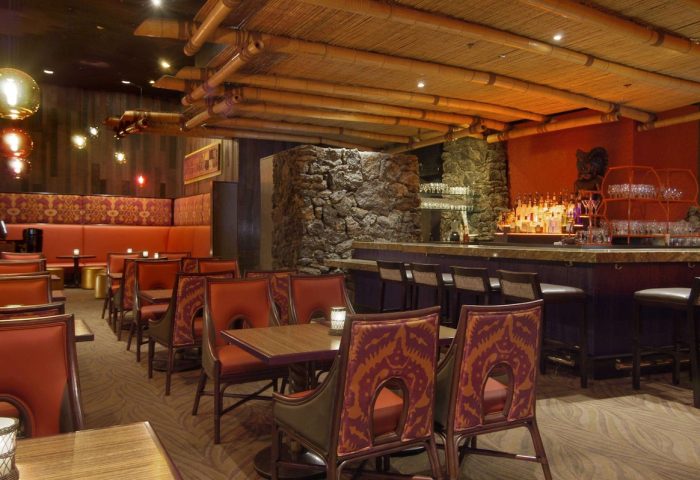 Gay-friendly The Fairmont San Francisco Hotel's Tonga Room & Hurricane Bar. Bamboo ceiling, stone details, and tropical-themed decor.