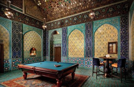 Gay-Friendly Hotel The Fairmont San Francisco Hotel billiard room. Ornate, Moorish-style design with pool table and bar. Luxurious gay travel.