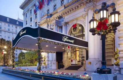 The Fairmont San Francisco Hotel entrance, a gay-friendly hotel, decorated for the holidays. A luxury travel destination.