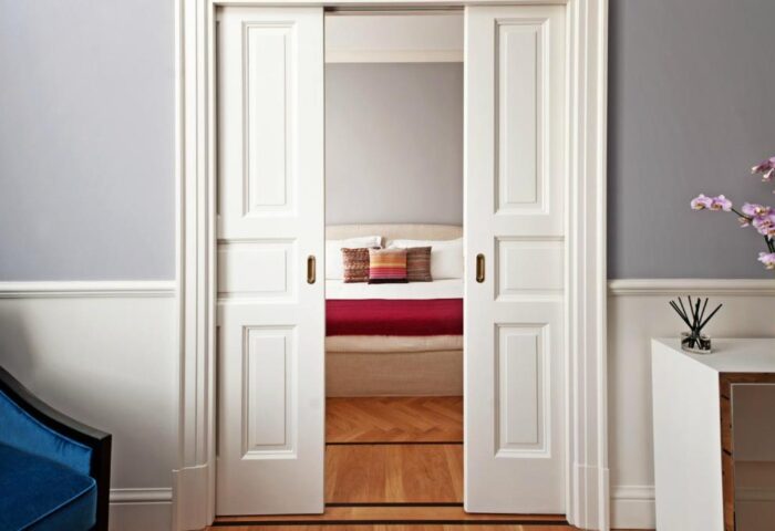 Bedroom view through sliding doors at The Fifteen Keys Hotel, a gay-friendly, pet-friendly hotel. Stylish interior design.