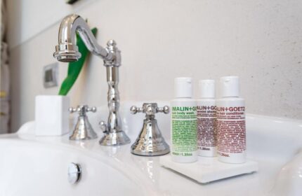 Bathroom sink with Malin+Goetz toiletries at The Fifteen Keys Hotel, a gay-friendly, pet-friendly hotel. Luxury travel for gay men.