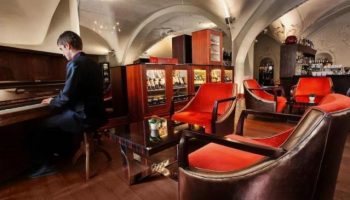 The Grand Mark Prague, a Leading Hotel. Pianist in the lobby bar. Gay-friendly, pet-friendly hotel in Prague. Luxury travel.
