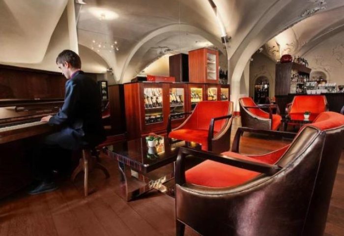 The Grand Mark Prague, a Leading Hotel. Pianist in the lobby bar. Gay-friendly, pet-friendly hotel in Prague. Luxury travel.