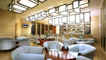 The Grove Suites by GRAND ASTON's gay-friendly hotel bar. A stylish lounge area with armchairs, tables, and a well-stocked bar for gay travelers.