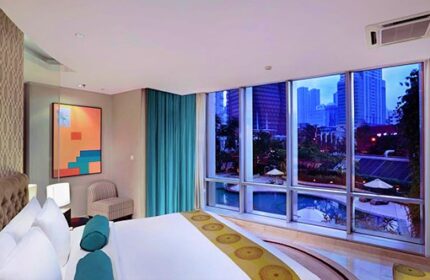 The Grove Suites by GRAND ASTON gay-friendly hotel room. City view, pool, modern design. Ideal for gay travelers seeking luxury & comfort.