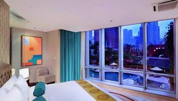 The Grove Suites by GRAND ASTON gay-friendly hotel room. City view, pool, modern design. Ideal for gay travelers seeking luxury & comfort.
