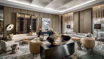 The Hazelton Hotel's stylish lounge area. This gay-friendly hotel offers luxury travel for gay men. Interior design with modern art and comfortable seating.