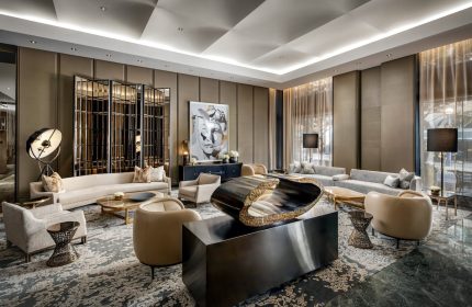 The Hazelton Hotel's stylish lounge area. This gay-friendly hotel offers luxury travel for gay men. Interior design with modern art and comfortable seating.