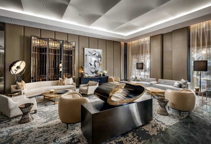 The Hazelton Hotel's stylish lounge area. This gay-friendly hotel offers luxury travel for gay men. Interior design with modern art and comfortable seating.