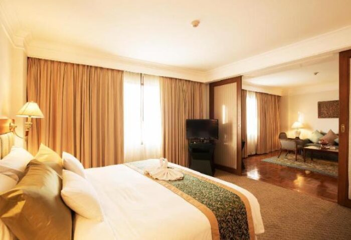 Imperial Mae Ping Hotel suite. Gay-friendly Chiang Mai hotel room with bedroom and living area. Comfortable and inviting for gay travelers.