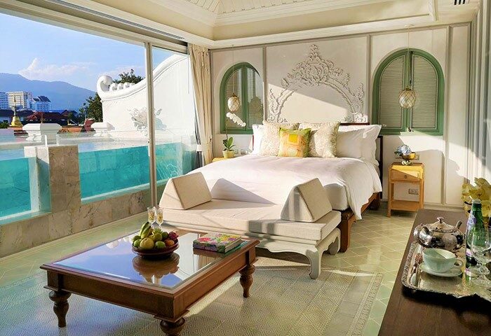 The Inside House gay-friendly hotel room. Luxury bedroom interior with pool view. Gay travel in style, Chiang Mai hotels.