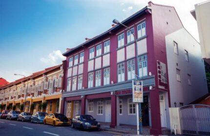 The Keong Saik Hotel exterior. Gay-friendly hotel in Singapore with colorful facade and street view. Boutique lodging for gay men travelers.