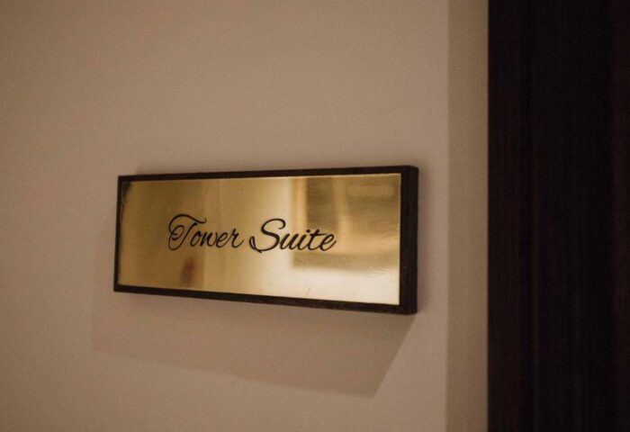 Tower Suite sign at The Lalit London, a gay-friendly hotel. Stay in luxury at this London hotel, perfect for gay travelers seeking comfort.