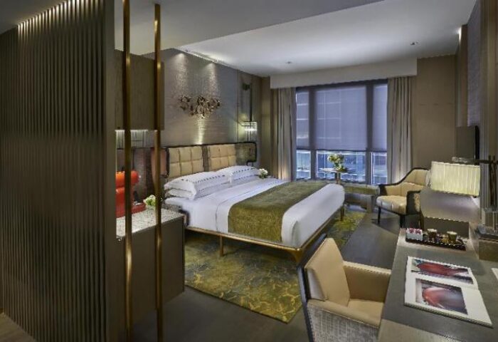 The Landmark Mandarin Oriental Hong Kong gay-friendly hotel room. Luxury suite with king bed, desk, city view. Perfect for gay travel.