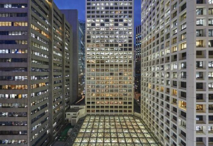 The Landmark Mandarin Oriental Hong Kong hotel view at night. Gay-friendly hotel with modern architecture, perfect for gay travelers.