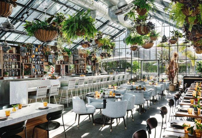 Gay-Friendly The Linq Hotel and Casino restaurant. Interior with plants, bar, tables and chairs. Great spot for gay travelers.