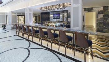 The London West Hollywood at Beverly Hills' bar. Upscale gay-friendly hotel with stylish bar stools and marble counter. Modern design.