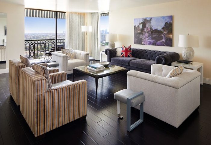 Living area at The London West Hollywood at Beverly Hills, a gay-friendly hotel. Plush seating, city view, and stylish decor.